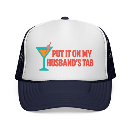 Dark Navy Put It on My Husband's Tab Trucker Hat, front view of the printed panel